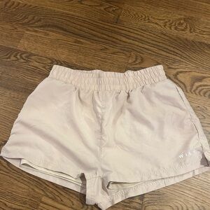 Wilo the Label Ladies board shorts size large.  Tan color drawstring